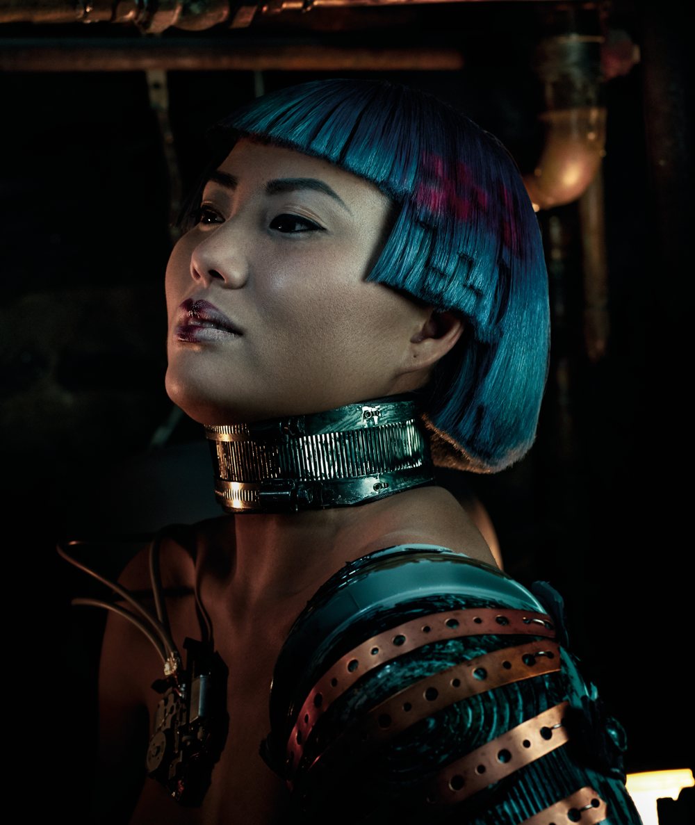 A model with a metal collar and armor of copper ribbons